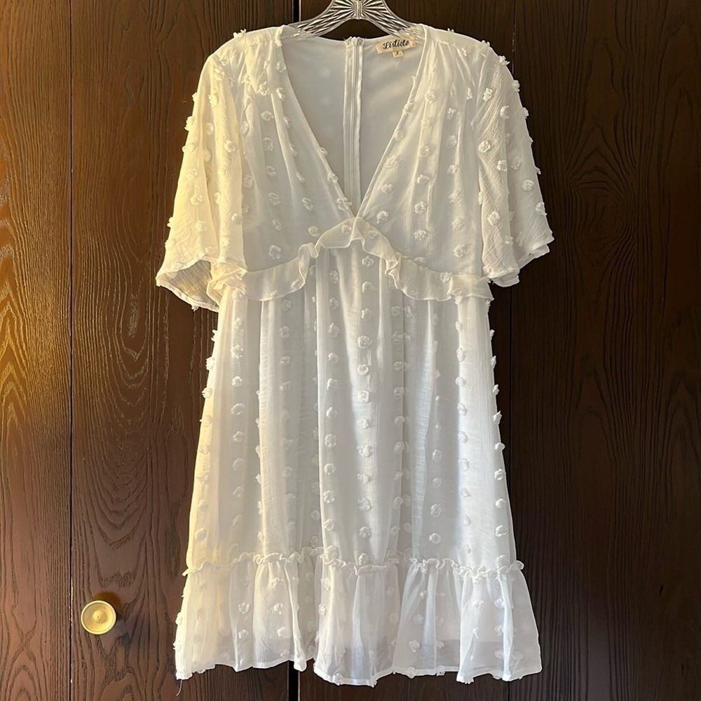 Listicle short sleeved white dress with raised cotton puffs. Size Small